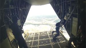 US Navy Paratroopers Jump From Plane