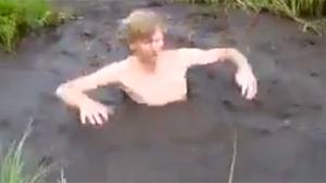 Crazy Guy Jumps In Deep Mud Pool