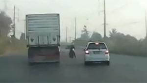 Madman Overtaking Truck