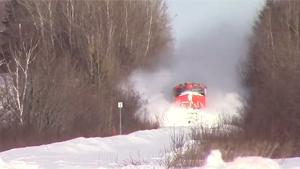 Train Plows Through Snow