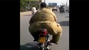Obese Guy Driving On Motorbike