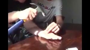 Nailing Hand To Table