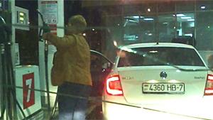 Woman At A Gas Station