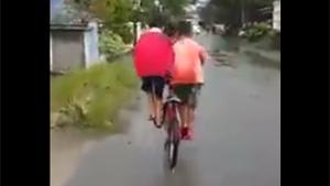Two Kids Riding One Bike