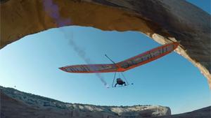 With Hang Glider Through Narrow Arch