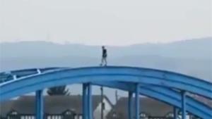Backflip On Top Of Bridge