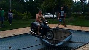 Motorcycle Stunt Ends Wet