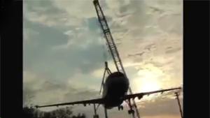 Crane Collapses With Plane