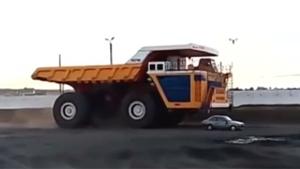 Massive Dump Truck Flattens Car