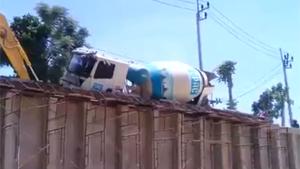 Cement Mixer Falls From Ramp