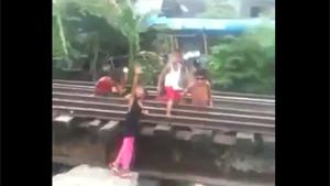 Kids Playing On Railroad Track