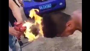 Chinese Man Tests Fireproof Hair