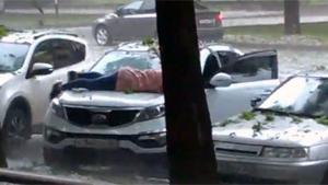 Lady Protects her Car From Hail