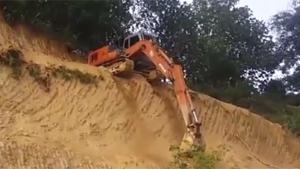 Excavator Takes The Short Way Down