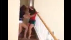 Fighting Girls Tumble From Stairs