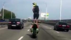 Crazy Biker Standsing On His Motorbike