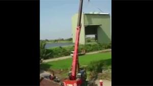 Crane Topples Over Due To Heavy Load