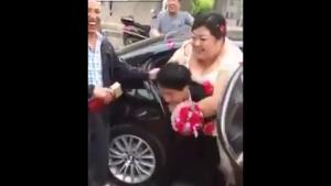 Groom Carrying His Obese Bride