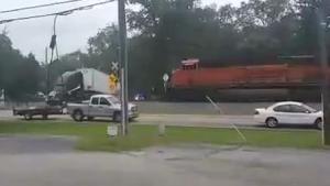 Train Splits Semi Trailer In Two