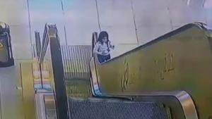 Kid Rescued From Escalator