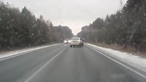 Slipping Car Crashes Into Oncoming Traffic