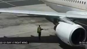 Man Walks Behind Running Jet Engine