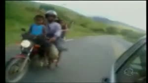 7 people on a motorcycle on highway in Brazil.