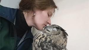 Woman Cuddling Her Eagle Owl