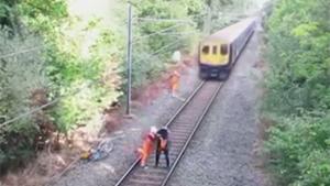 Sick Rescue In Front Of Oncoming Train