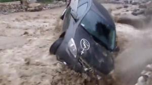 Man Tries To Cross Mud Flood In Car
