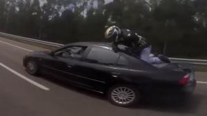 Biker Crashing Into Back Of Car