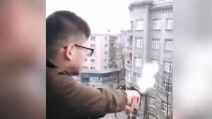 Psycho Kid Fires Gun From Balcony