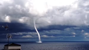 Cool Waterspout Over Lake